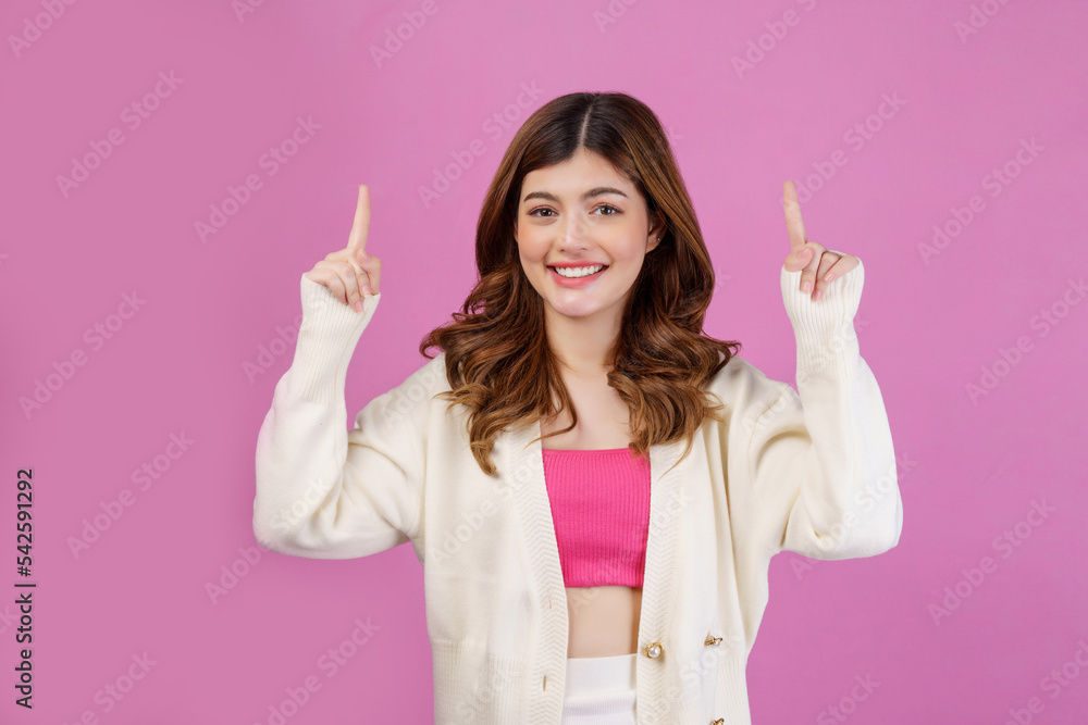 Portrait of Surprised young woman pointing to empty copy space for product over isolated pink background Portrait of Surprised young woman pointing to empty copy space for product over isolated pink background