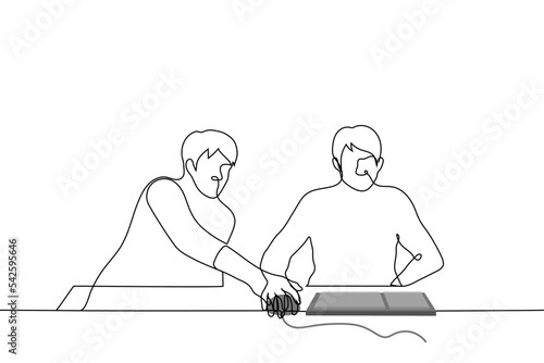 man directs the mouse of an annoyed person who is sitting at the computer and is already holding this mouse - one line drawing vector. concept to guide, teach, instruct