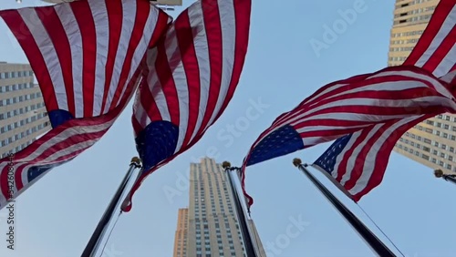 American flags in downtown New York flutter in the wind.