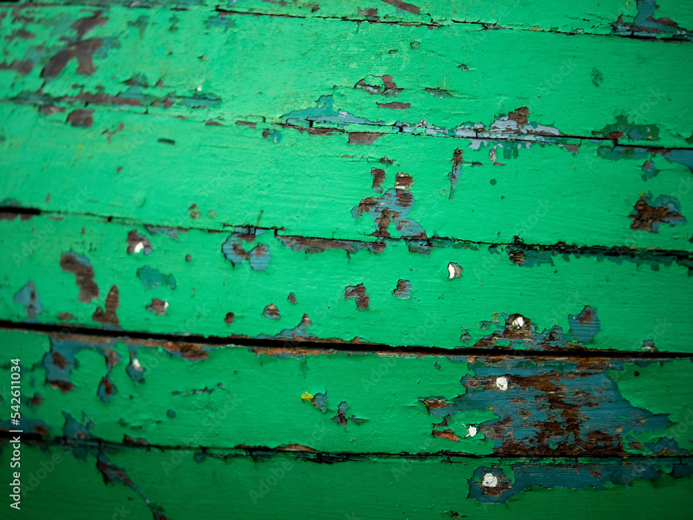 Green old wood surface of an old boat. Selective focus. Background for design purpose. Vintage worn out timber. Green old wood surface of an old boat. Selective focus. Background for design purpose. Vintage worn out timber.