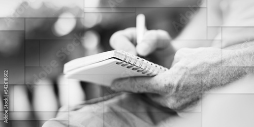 Man taking notes on a pocket book, geometric pattern photo