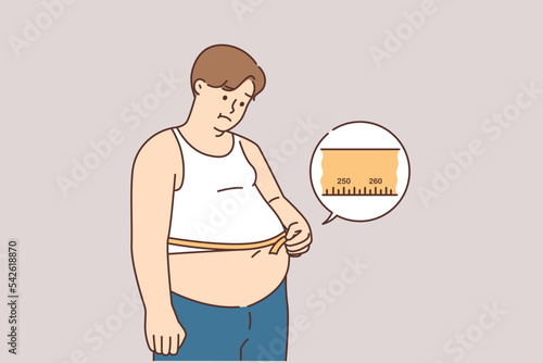Unhappy fat man measure belly with tape 