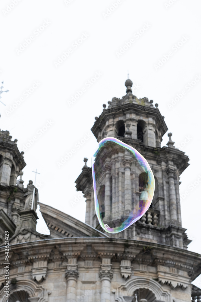 A soap bubble floats in front of the Virgen Peregrina church in the village of Pontevedra (Spain)