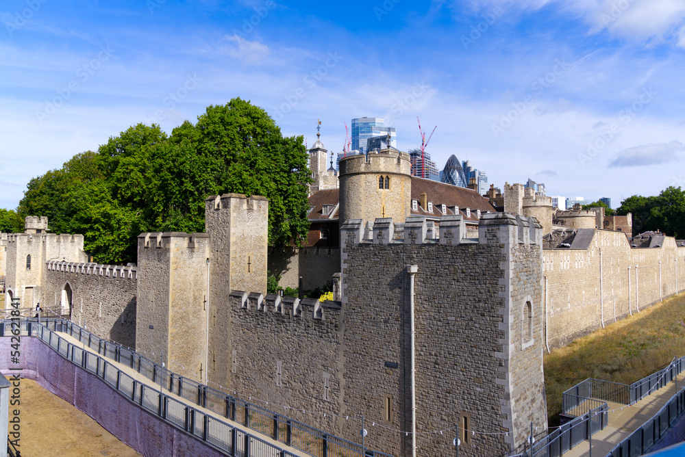 Famous castle Tower of London at City of London on a blue cloudy summer day. Photo taken August 4th, 2022, London, England.