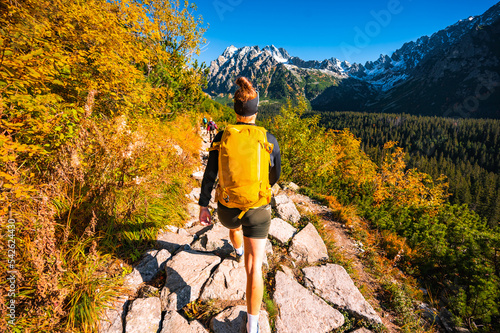 Hiking Strbske lake to popradske lake , very popular hiking destination in High Tatras National park, Slovakia. Autumn color nature . photo