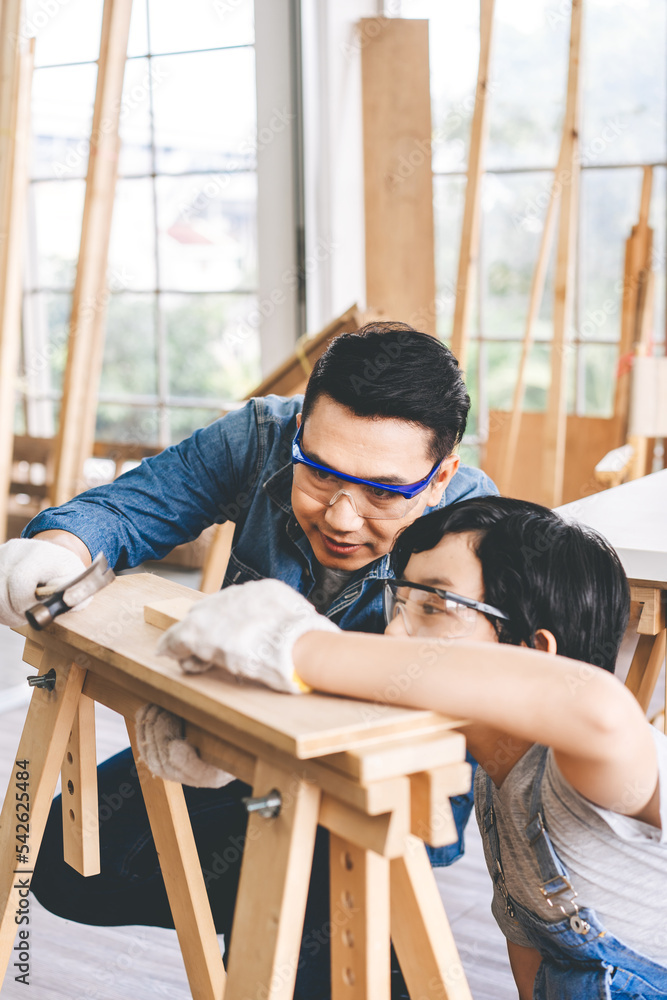 Southeast asian family father and son diy or repair for crafts skill at home workshop Southeast asian family father and son diy or repair for crafts skill at home workshop