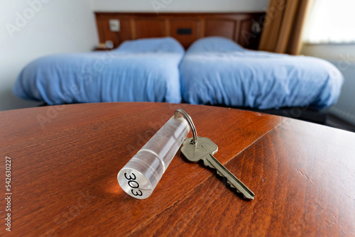 hotel key on table in standard room photo