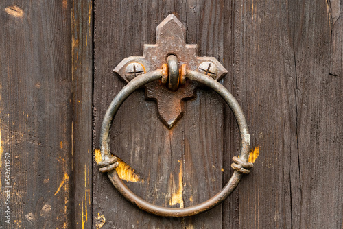 Fotografie Iron ring on an old scratched wooden door Konigsberg Cathedral