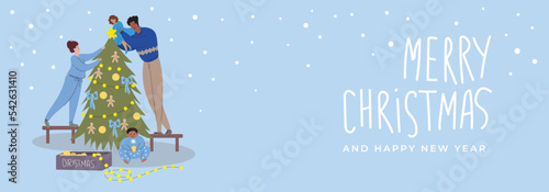 Merry Christmas banner with an interracial family decorating the Christmas tree. Mom, dad, son and daughter are preparing for Christmas. Little girl putting a star on Christmas tree