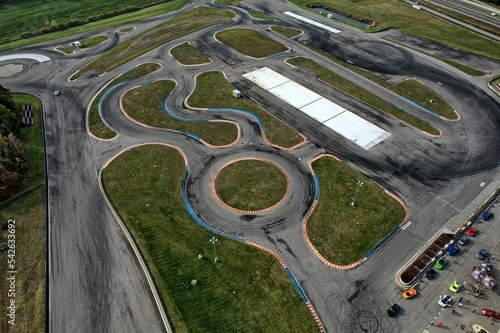Obraz na płótnie car racing track and racing cars as seen from above from a drone. Fast, luxury cars. w salonie