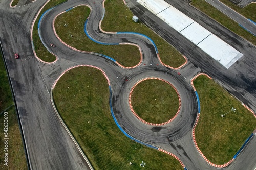 Obraz na płótnie car racing track and racing cars as seen from above from a drone. Fast, luxury cars. w salonie