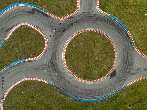 Obraz na płótnie car racing track and racing cars as seen from above from a drone. Fast, luxury cars. w salonie