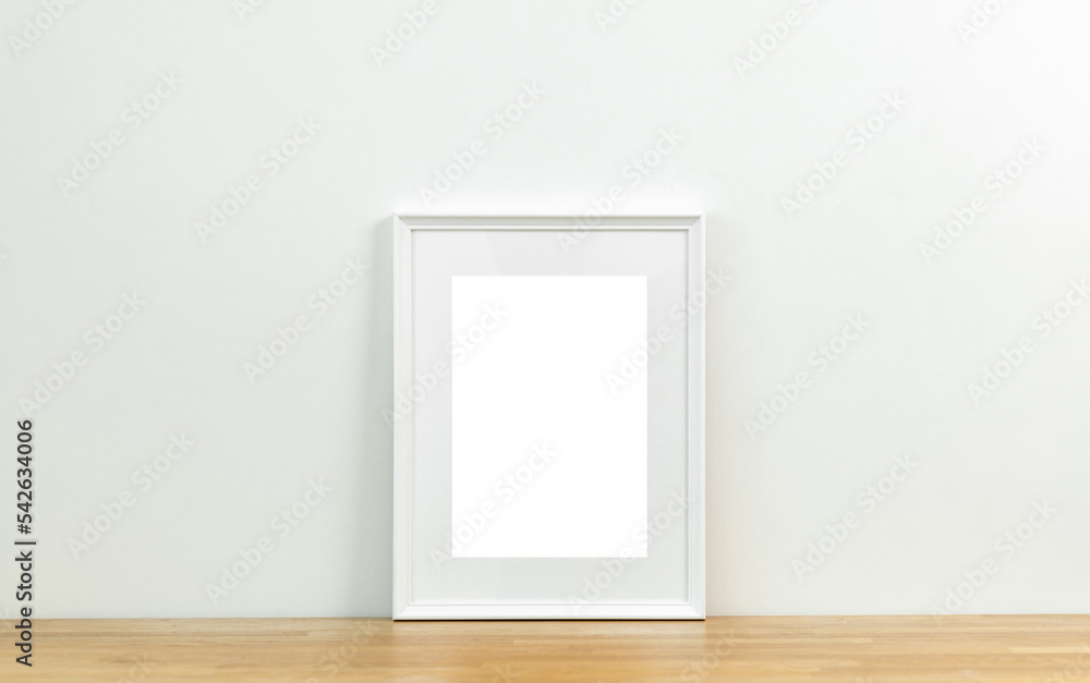 Style picture frame still life put on the wooden table. Blank space empty picture frame with mockup. Shot in studio with natural light. Template background interior design and decoration. Style picture frame still life put on the wooden table. Blank space empty picture frame with mockup. Shot in studio with natural light. Template background interior design and decoration.