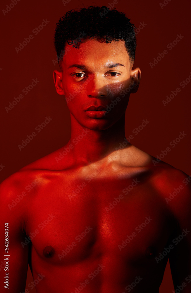 Beauty, body and aesthetic of young man in studio with neon red light for skincare, exercise or fitness background. Portrait of male commitment to exercise, health and body wellness for inspiration Beauty, body and aesthetic of young man in studio with neon red light for skincare, exercise or fitness background. Portrait of male commitment to exercise, health and body wellness for inspiration