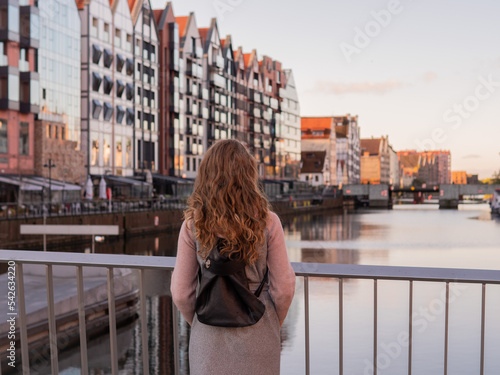 Tourist exploring old town in Gdansk, Poland © seligaa
