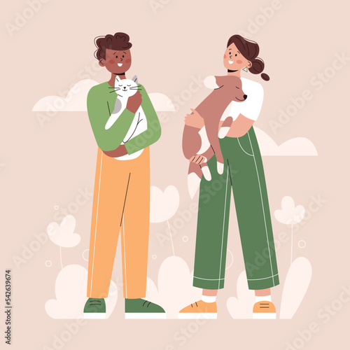 The concept of helping and loving pets. A woman and a man hold a cat and a dog in their arms.