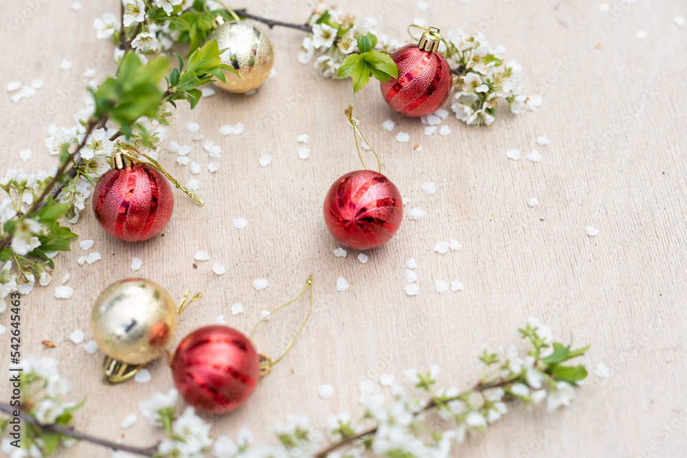 Christmas decorations and a branch with a flower