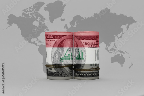 national flag of iraq on the dollar money banknote on the world map background .3d illustration