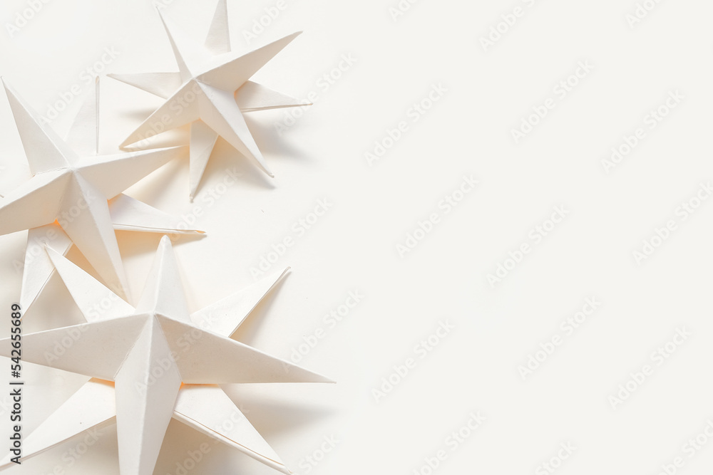 Merry Christmas.Christmas stars handmade light beige background.Monochrome,Christmas background,holiday card.DIY christmas flat lay copy space.Christmas zero waste, paper, eco postcard Merry Christmas.Christmas stars handmade light beige background.Monochrome,Christmas background,holiday card.DIY christmas flat lay copy space.Christmas zero waste, paper, eco postcard