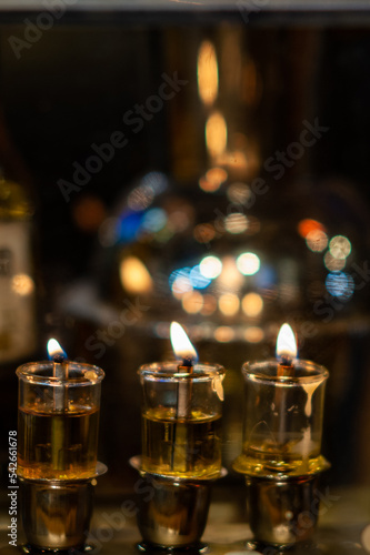 Hanukkah menorah with oil lights burning in Jerusalem during the celebration of the Festival of Lights in Israel. © Yehoshua Halevi