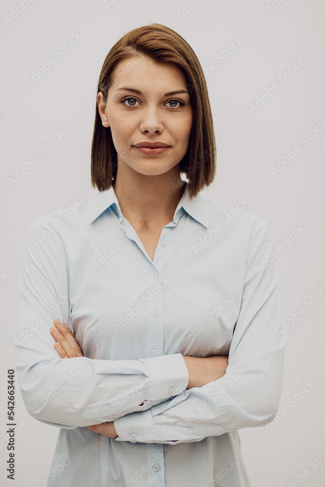 Portrait shot of a beautiful blond businesswoman standing with arms crossed at isolated white background. High quality photo Portrait shot of a beautiful blond businesswoman standing with arms crossed at isolated white background. High quality photo