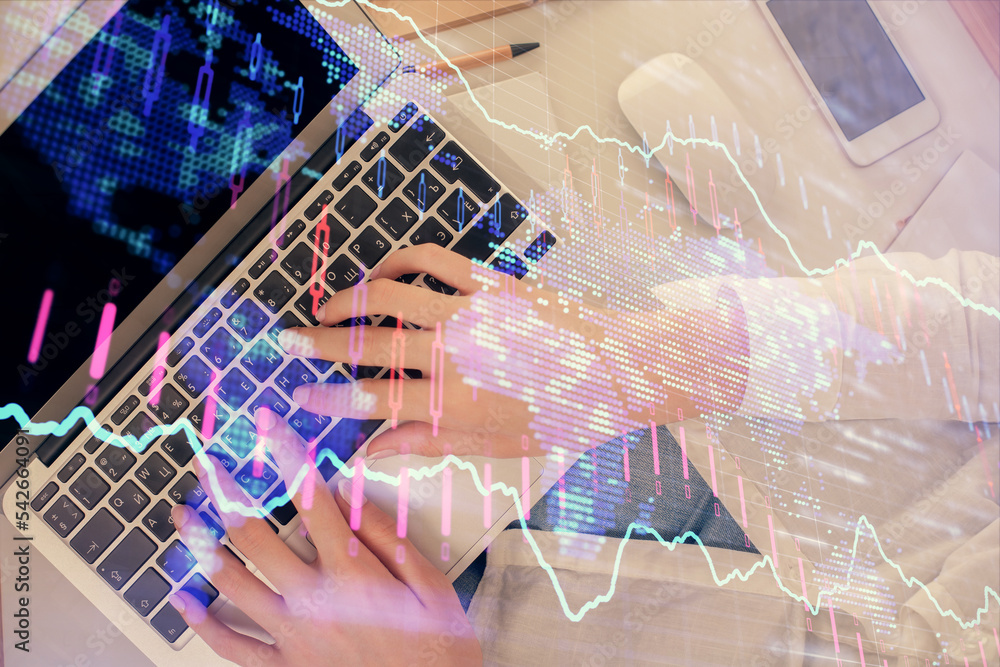 Double exposure of woman hands working on computer and forex chart hologram drawing. Top View. Financial analysis concept.