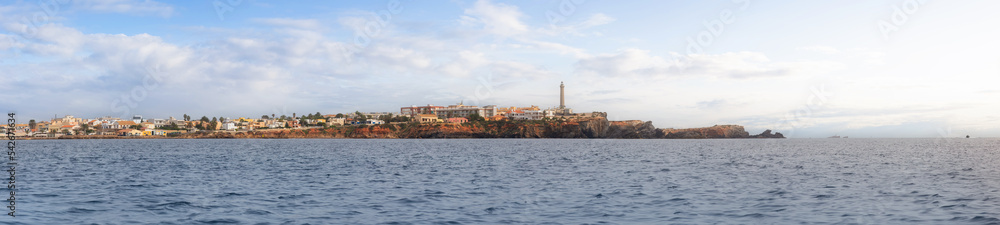 Homes in a touristic Spanish Town by the Mediterranean Sea. Cloudy Sunrise Sky Art Render. Cape Palos, Spain. Panorama