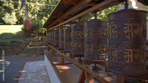 closeup view Prayer wheels in Lama Tzong Khalpa Institute in Pomaia, Tuscany, Italy
 photo