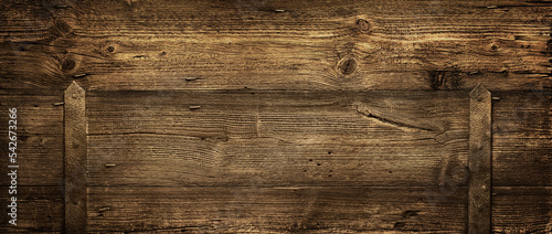 Old dark brown rustic wooden texture, wood background from old barn door, panorama, banner, long
