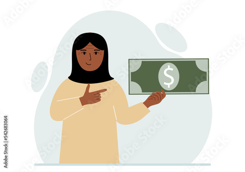 A arab woman holds a large paper bill in his hand. The concept of income, expense, earning or spending money.