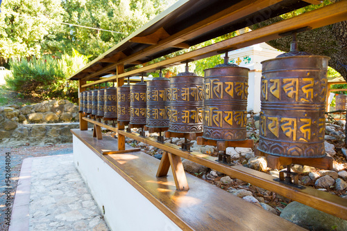 Tela closeup view Prayer wheels in Lama Tzong Khalpa Institute in Pomaia, Tuscany, It