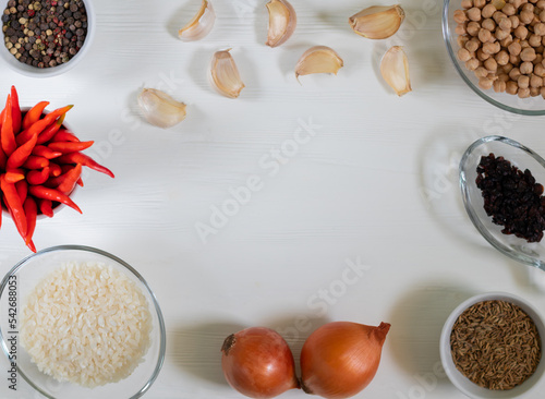 Ingredients for vegetarian pilaf with chickpeas t on a white background