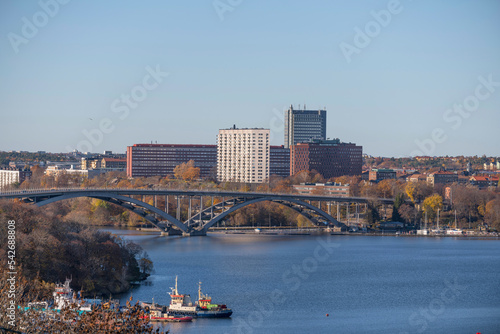 Panorama hill view over the bay Riddarfjärden with wharf, long bridge Västerbron and skyscrapers apartments and offices a sunny autumn day in Stockholm