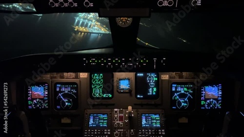 Unique night view from a jet cockpit durinng the approach to Valencia’s airport, Spain. Pilot point of view. photo