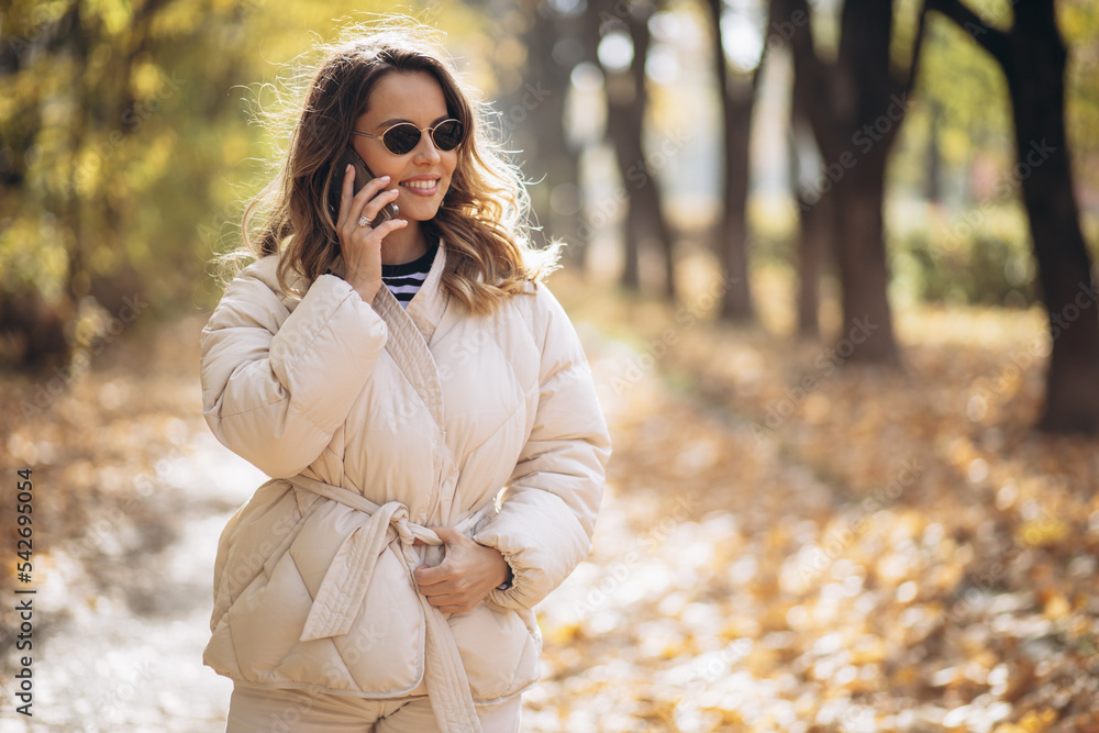 Portrait of beautiful woman smiling and talking on the phone Portrait of beautiful woman smiling and talking on the phone