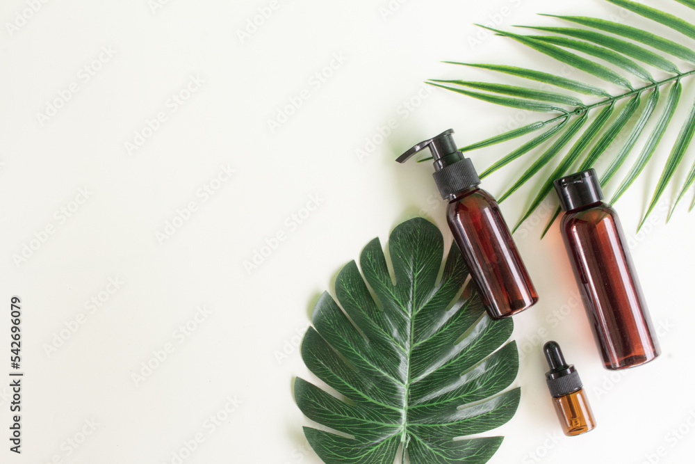 Organic natural beauty care with green topical leaves. Beauty product in flatlay style. Organic natural beauty care with green topical leaves. Beauty product in flatlay style.