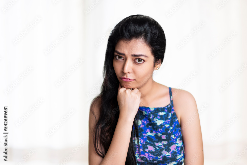 Worried young woman portrait on white. Worried young woman portrait on white.