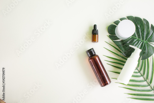 Organic natural beauty care with green topical leaves. Beauty product in flatlay style.