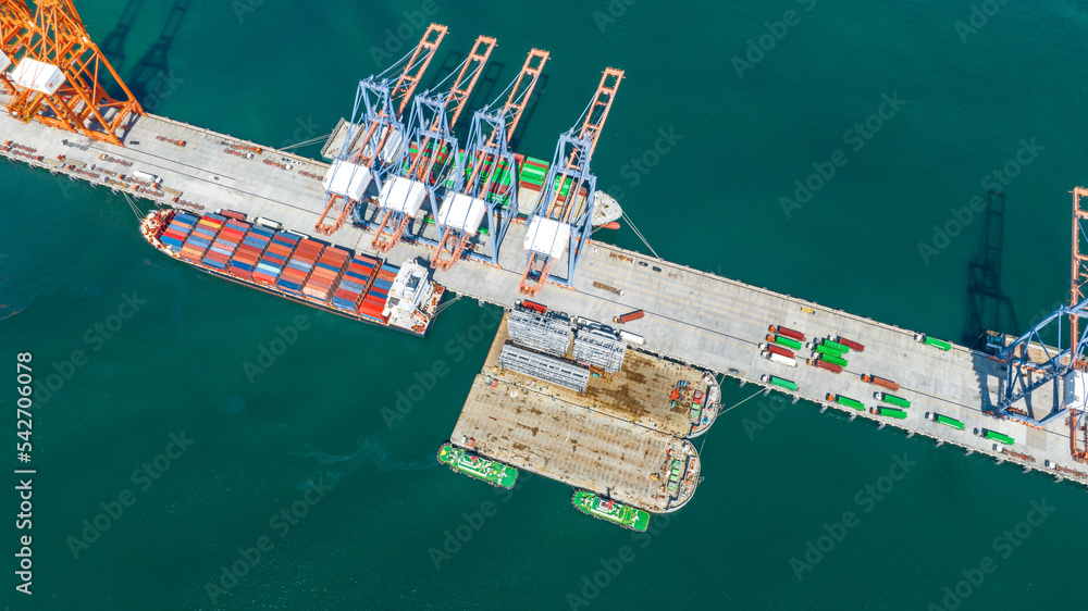 Cargo container Ship running to Bridge Cargo Shipyard Container ship under the crane Sea Port service logistics and transportation. International Shipping Depot Customs Port for import export trade.