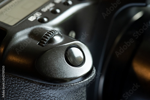 Simple generic photo camera shutter release button, object detail, macro, extreme closeup, nobody. Photography equipment symbol, photographing abstract concept, nobody, no people, part of a camera