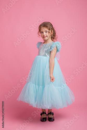 little girl pink background, beautiful princess dress
