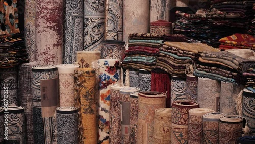 Details of traditional Turkish carpet in Istanbul shop, Turkey. Close up of Middle Eastern Arabian carpets in market store. photo