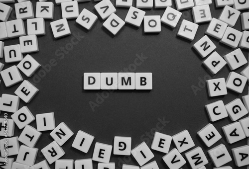 Letters spelling out dumb