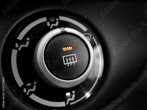 Defrost Button in Car On Orange Light