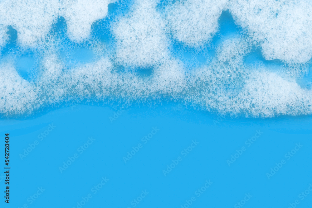 Soap foam. Background of dusty foam with bubbles of blue color for an inscription. Soap sud with copy-space Soap foam. Background of dusty foam with bubbles of blue color for an inscription. Soap sud with copy-space