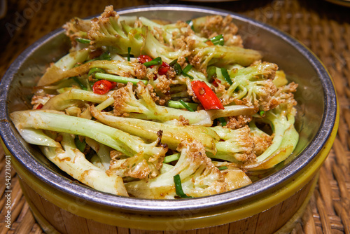 A plate of delicious dry and fragrant fried cabbage flowers