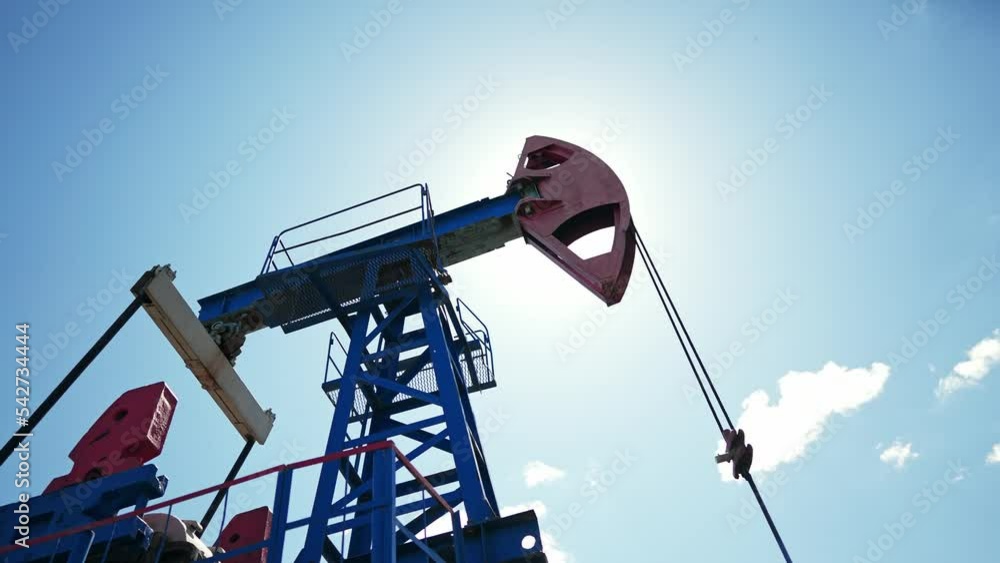 oil pump. oil rig mechanism pumping oil and gas lifestyle. business industry concept. rig energy petroleum barrel. oil pump pumps from the ground business finance concept oil pump. oil rig mechanism pumping oil and gas lifestyle. business industry concept. rig energy petroleum barrel. oil pump pumps from the ground business finance concept