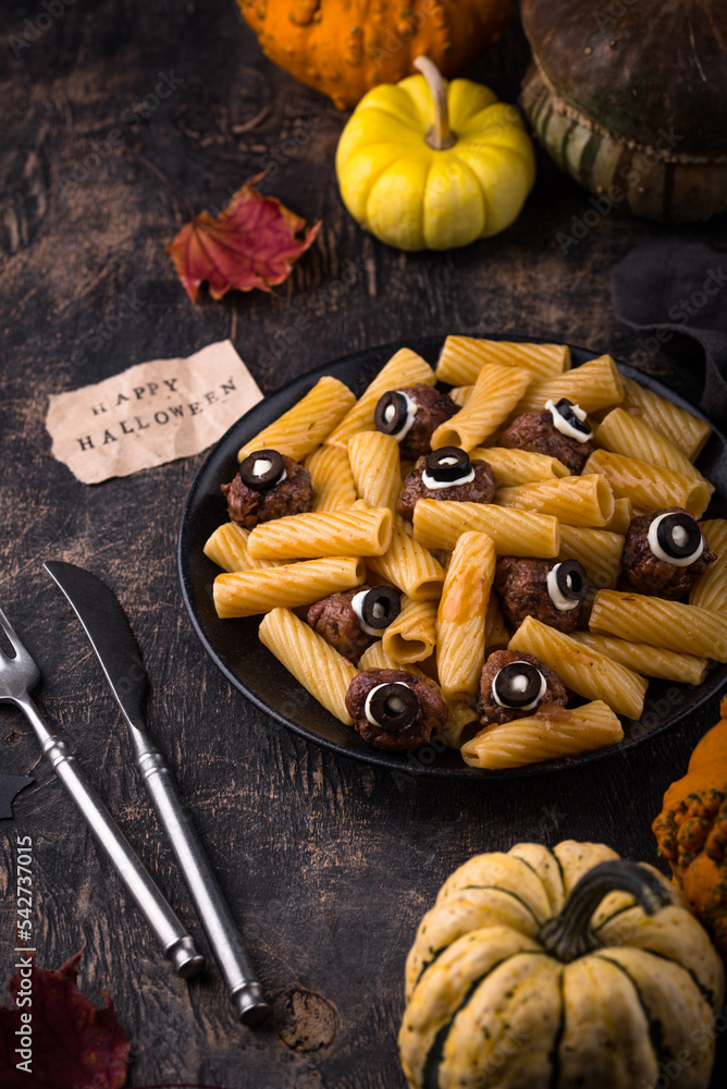 Halloween pasta with meatballs in shape of eye Halloween pasta with meatballs in shape of eye