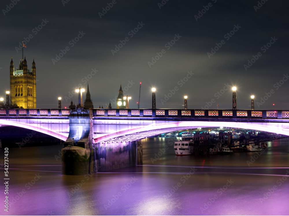 Fototapeta premium A night view of the Lambeth bridge located on the Thames river in London England.