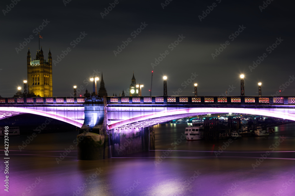 Fototapeta premium A night view of the Lambeth bridge located on the Thames river in London England.